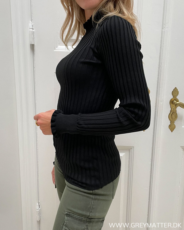 Damebluse med flotte detaljer i sort
