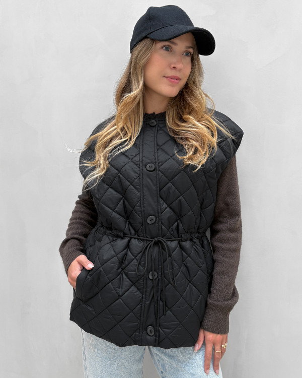 Quiltet sort overgangsvest