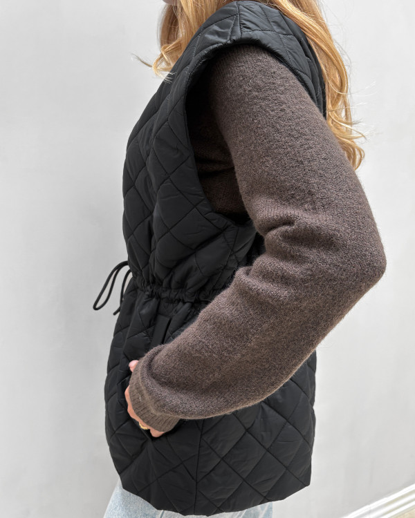 Quiltet sort overgangsvest