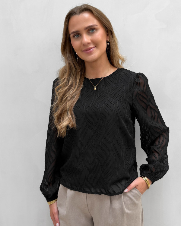 Sort bluse med mønster i stoffet